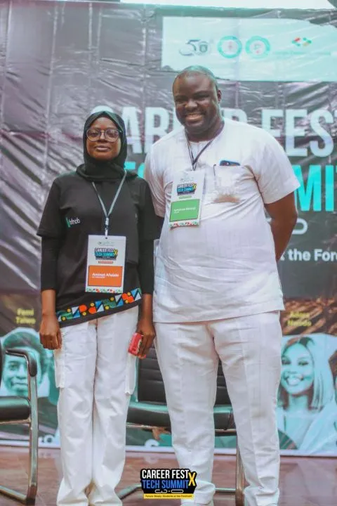 Aminat standing beside Iyinoluwa Aboyeji at CareerFest X TechSummit