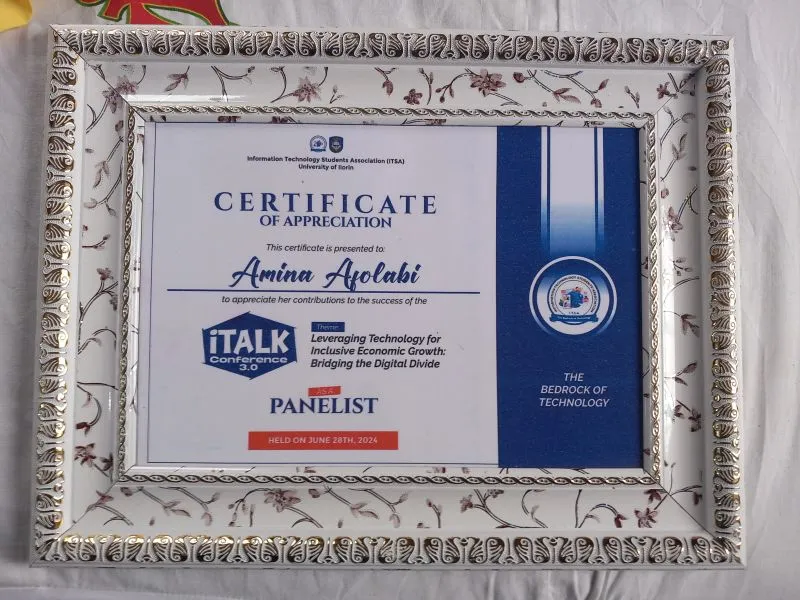 Framed certificate naming Amina Afolabi as a panelist at iTalk Conference 3.0